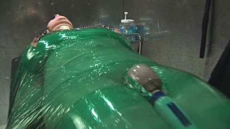 Green Plastic - Bound to her bench in green plastic, chanta torments her aching pussy one more time
and extracts yet another orgasm from her.