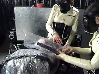Pointless Struggles - The prisoner was encased in latex, cocooned in plastic, then strapped down with heavy rubber belts. The prisoner is punished with severe **************. His struggles were pointless but fun to watch none the less