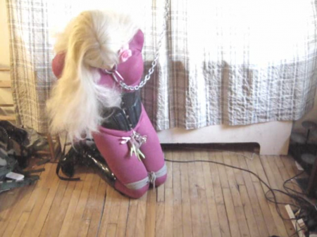 Doll Bound In Chastity - Angelika doll is bound up and dollified, and in chastity! She struggles n struggles... No use! She is bound and locked to a chain to her collar, and in chastity as well!