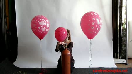 Shiva Kitty Helium Inflates Balloons - Shiva kitty fills her first pink 16 inch qualatex hugs and kisses balloon and a pink 16 inch qualatex hearts print balloon with helium!