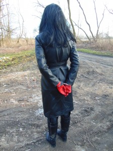 A Small Walk In A Leather Coat And With Handcuffs - In the long leather coat, leather trousers and a tight red leather opera gloves. Posing and walked with handcuffs. Filmed and photographed on march 9 this year.