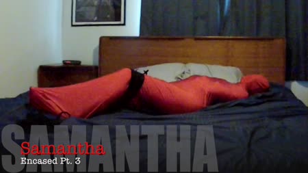 Samantha Spandex Encasement 3 - In this clip, I take Samantha out of her spandex sleepsack, but I leave her tight gag and straightjacket on. Im not finished yet.. I toss her back on the bed and frogtie her legs so she can enjoy that new position for a while..